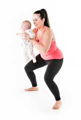 Sport motherhood and active lifestyle of young mother workout together with her baby