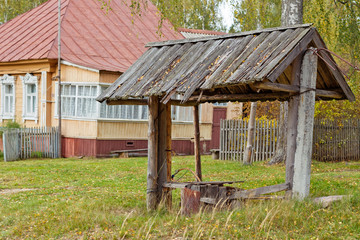 Fototapeta premium wooden well at the house in the Russian village