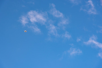 Naklejka na ściany i meble Buenos Aires, Argentina; March 24, 2019: A drone flying in the middle of the sky