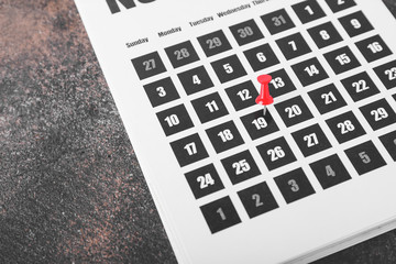Calendar with marked date on table. Deadline concept