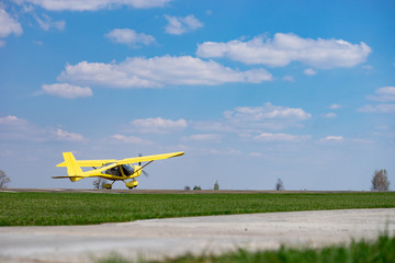 Small Plane Taking Off from green field. Concept of increase and development