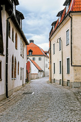 Fototapeta na wymiar street view with old buildings in Visby old town in Sweden