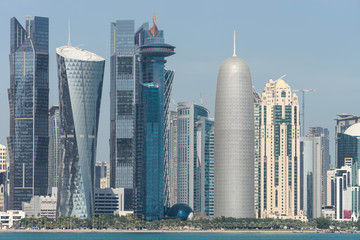 Naklejka premium View of city center with skyscrapers from the other side of sea in Doha, Qatar 