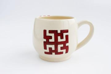 ceramic mug with the ancient Slavic sign Dukhobor