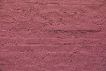 Alte Fuchsia-Coral Steinwand in der Altstadt.