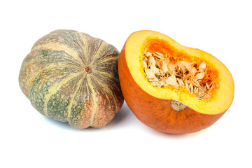 Whole and halved pumpkin with seeds isolated on white background