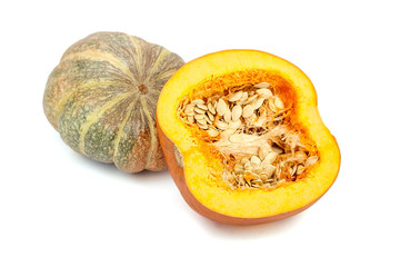 Whole and halved pumpkin with seeds isolated on white background