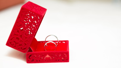Obraz na płótnie Canvas Wedding Ring in Red Velvet Silk Box