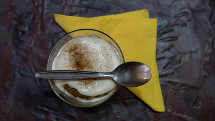 Milk dessert with chocolate powder on top