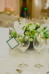 Wedding table decoration, wedding setting, wedding flowers on table, shallow depth of field