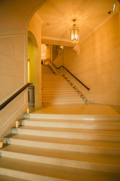 Luxury large white marble staircase, frontal view.