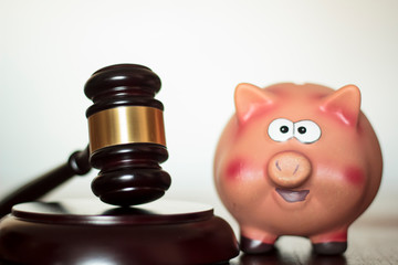 Judge's gavel and piggy bank