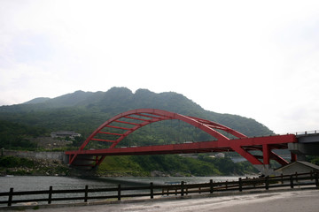 Fototapeta premium Red arch bridge in the rural area