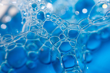 different size of soap bubbles in water