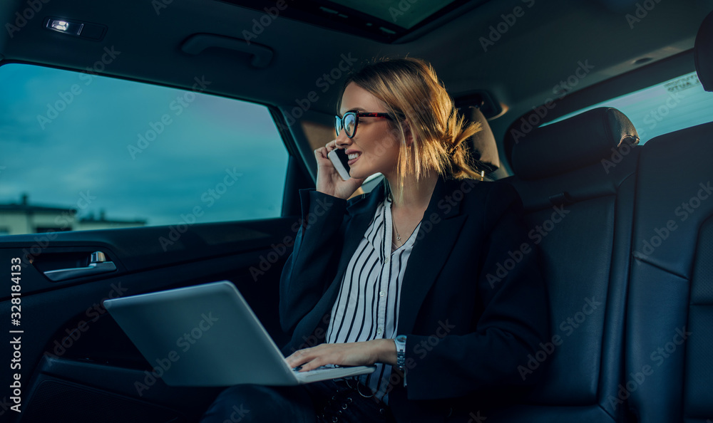 Wall mural young business woman working on lap top. young business woman using computer for on line meeting.