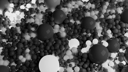 beautiful shiny balls of different shades of gray and sizes completely cover surface. Some spheres glow. 3d photorealistic render geometric holiday background of shiny balls
