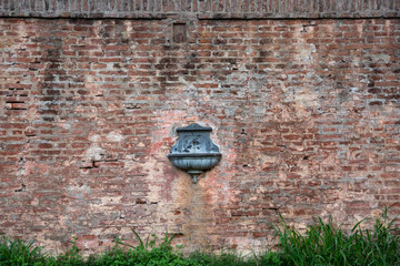 Antique drinking fountain - sprue - spout on a train station