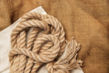Rope on burlap background fabric texture