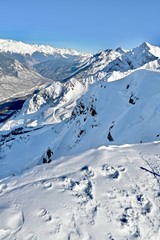 Fototapeta na wymiar snow-capped mountain peaks in a ski resort