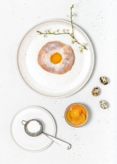 Delicious soft roll bread with apricot and powdered sugar for easter. Homemade sweet food concept. Flat lay.