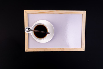 Coffee mug and black background with top view.