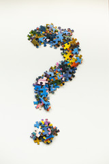 question mark made from colorful puzzle pieces