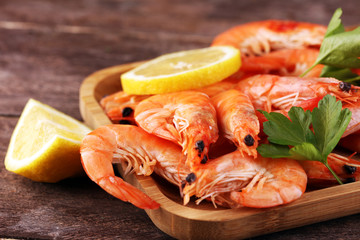 Raw fresh Prawns Langostino Austral. shrimp seafood with lemon and spices on background