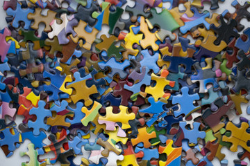 Pile of colourful jigsaw puzzle pieces