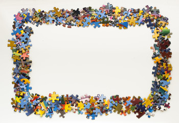 Jigsaw puzzle pieces arranged in a frame