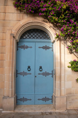 Fototapeta na wymiar Bright colourful door way in a stone building