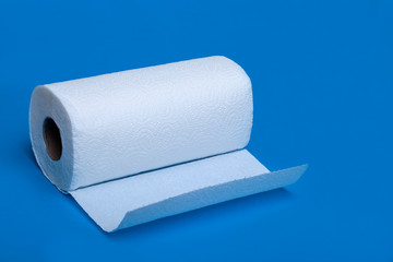roll of toilet paper isolated on blue