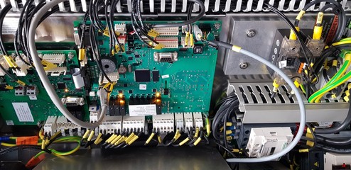 motherboard of an oven with all electrical connections and other items