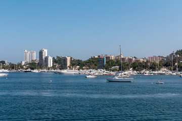 view of city of Acapulco, sea view, boats and sun