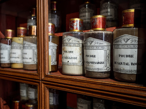 Vintage vials with ointments, infusions and powders, homeopathy. Medieval pharmacy.
