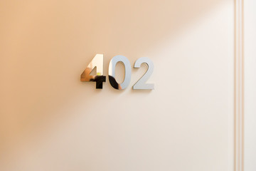 Number 402 on hotel room door