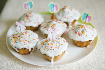 Easter bunny cupcakes. Easter cakes decorated with cream, bunny face.