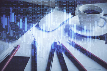Fototapeta premium Financial graph colorful drawing and table with computer on background. Multi exposure. Concept of international markets.