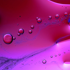 Macro PHOTO abstract of oil and water bubbles in shades of red and purple