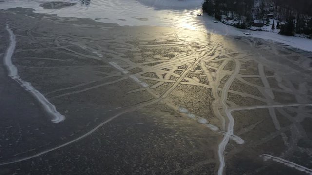 Frozen Lake High Up Drone View In Winter With Snow Trails 02