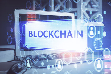 Multi exposure of blockchain and crypto economy theme hologram and table with computer background....