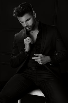 Handsome elegant man in black suit.