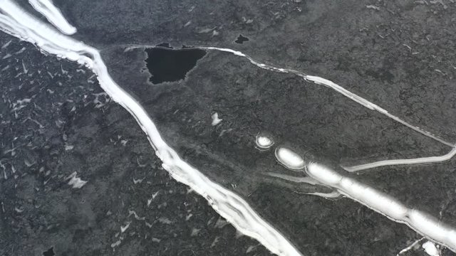 Frozen Lake High Up Drone View In Winter With Snow Trails 01