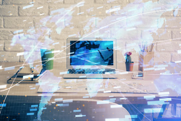 Double exposure of desktop computer and technology theme hologram. Concept of software development.