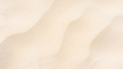 Fototapeta na wymiar Closeup shot of sand texture on the beach as background