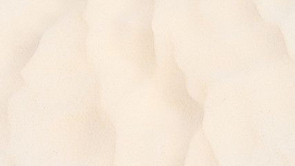 Naklejka premium Closeup shot of sand texture on the beach as background