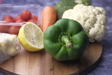 Close up of fresh vegetable on shopping board 
