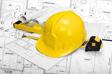 Worker helmet and drawing architecture or construction blueprint