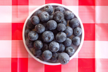 top view of blue berry on plate on table 