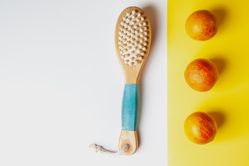 Anti-cellulite massage brush on a white background. Orange peel cellulite concept. Lymphatic drainage massage. Place for text. organic cactus brush