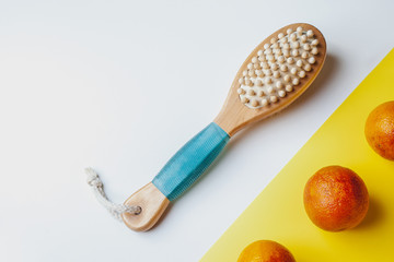 Anti-cellulite massage brush on a white background. Orange peel cellulite concept. Lymphatic drainage massage. Place for text. organic cactus brush